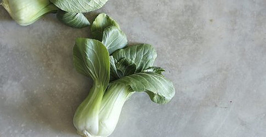 Black Behi pechay heads with broad green leaves, fast-maturing open-pollinated variety